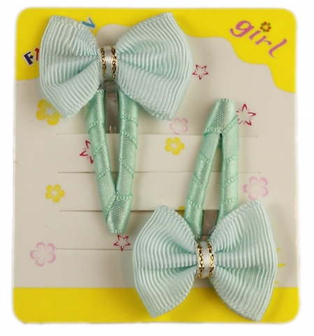 Pair of turquoise hair clips with bow