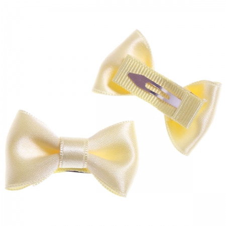 Pair of ivory hair clips with bow